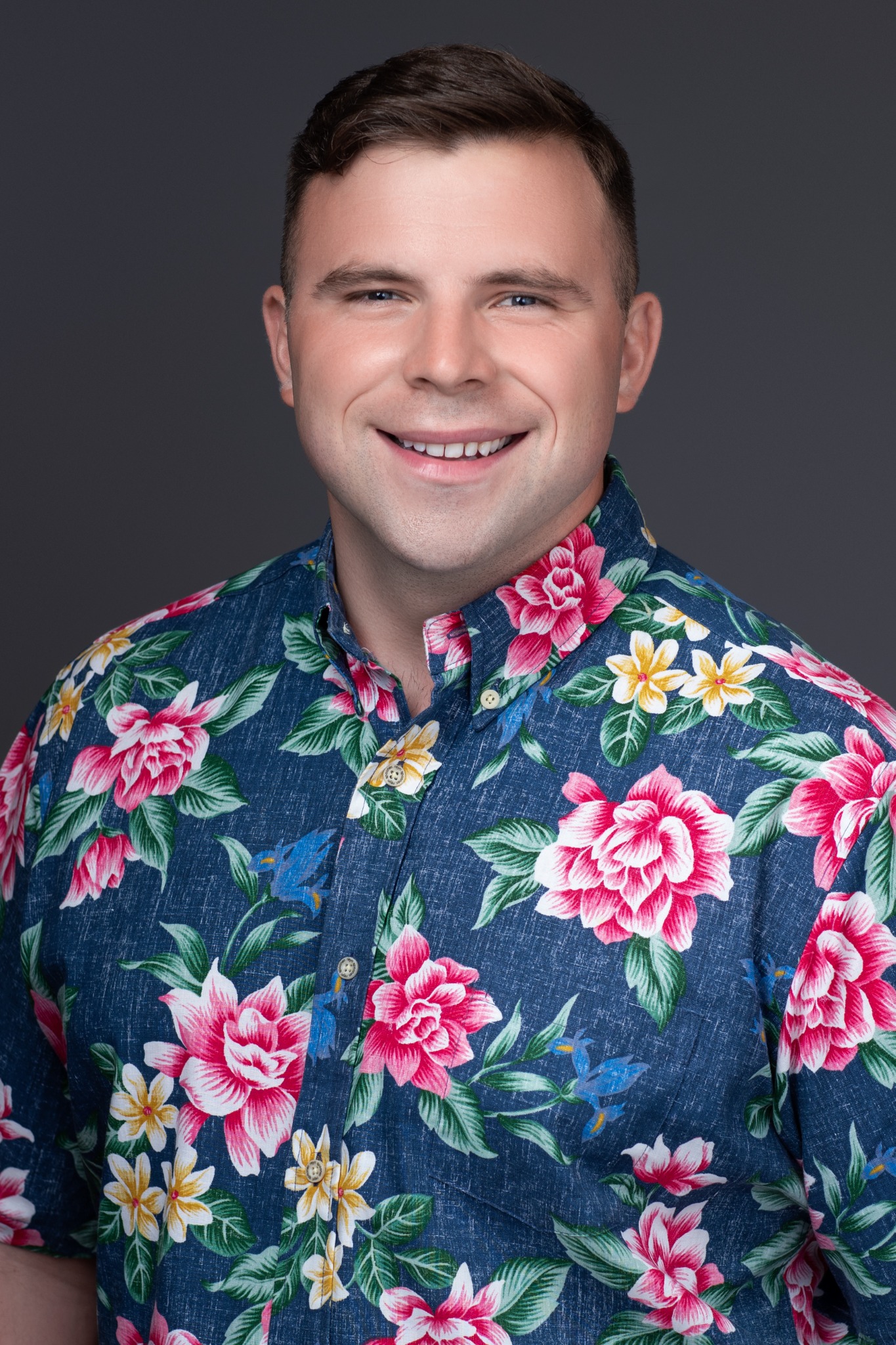 Casey Lund wearing a pink floral aloha shirt