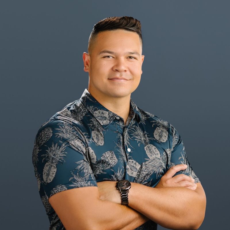 Kainoa Carlson wearing a dark aloha shirt